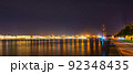 Night panorama of the Neva River and St. Petersburg, Russia. View of the Fregat Blagodat and the Trinity Bridge 92348435