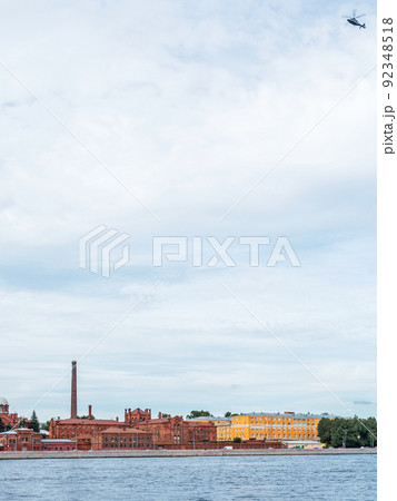 Helicopter flying over the Neva River in St. Petersburg, Russia and Kresty prison, vertical photo Helicopter flying over the Neva River in St. Petersburg, Russia and Kresty prison, vertical photo 92348518
