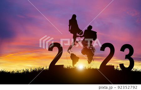 Silhouette 2023 years in sunset background. New Year Celebration for Couple or Partner. Happy New Year and Merry Christmas. Copy space. Silhouette 2023 years in sunset background. New Year Celebration for Couple or Partner. Happy New Year and Merry Christmas. Copy space. 92352792