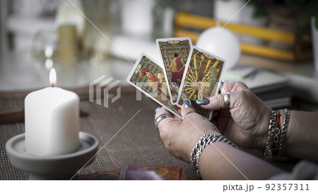 Concept of psychic advisor or ways of divination with cards. 92357311