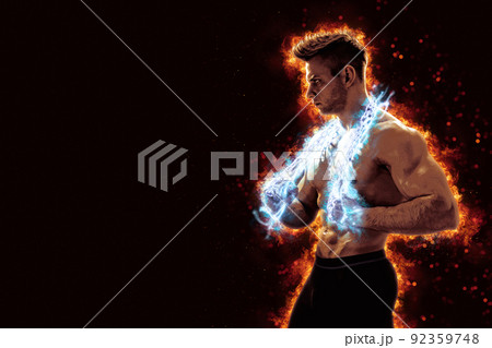 Muscular man with naked torso holding electric energy chain. Isolated on dark background with fire Muscular man with naked torso holding electric energy chain. Isolated on dark background with fire 92359748