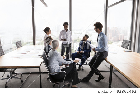 Happy confident African American business coach training interns Happy confident African American business coach training interns 92362492