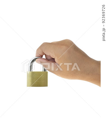 Metal padlock in hand isolated on white background Metal padlock in hand isolated on white background 92369726