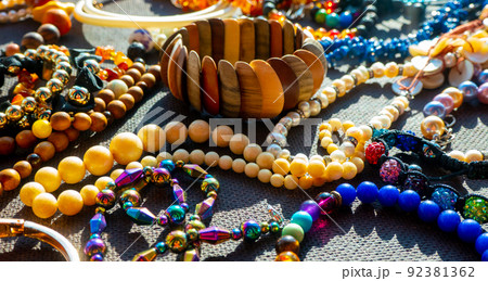 a lot of costume jewelry with different materials on a black background a lot of costume jewelry with different materials on a black background 92381362