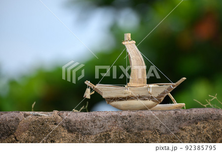 Handmade small traditional wooden boat showcase at Galle fort. miniature woodwork souvenirs. 92385795