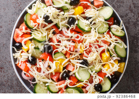 Shopska salata vegetables Chopped Salad with cheese closeup in the plate. Horizontal top view 92386468
