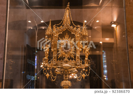 Close-up of religious offering in transparent glass cabinet at La Seu Cathedral 92386870