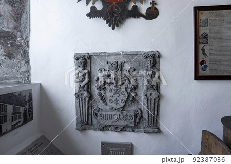 Carved structure with photographs and frames at old pharmacy museum in historic town 92387036