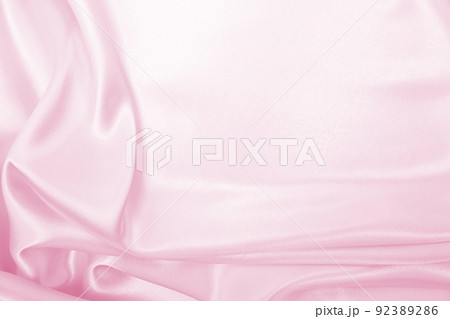Smooth elegant pink silk or satin texture as wedding background. Luxurious background design Smooth elegant pink silk or satin texture as wedding background. Luxurious background design 92389286
