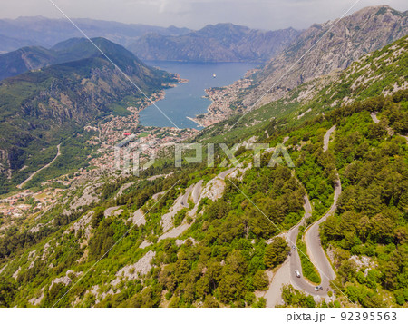 Aerial view on the Old Road serpentine in the national park Lovcen, Montenegro Portrait of a disgruntled girl sitting at a cafe table Aerial view on the Old Road serpentine in the national park Lovcen, Montenegro Portrait of a disgruntled girl sitting at a cafe table 92395563