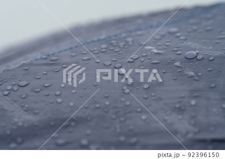 Raindrops on a blue tent close-up. Raindrops on a blue tent close-up. 92396150