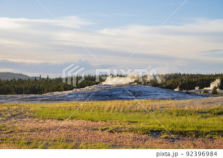 Sunset view of the Old Faithful geyser Sunset view of the Old Faithful geyser 92396984