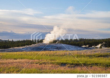 Sunset view of the Old Faithful geyser Sunset view of the Old Faithful geyser 92396987