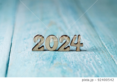 The year 2024 in large numbers on a blue background. Elements for calendar design. The year 2024 in large numbers on a blue background. Elements for calendar design. 92400542