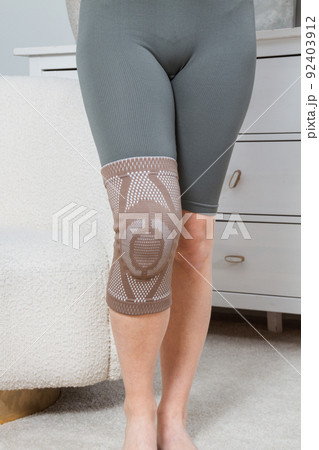 Knee support brace on a woman leg. girl in an - Stock Photo [92403912] -  PIXTA