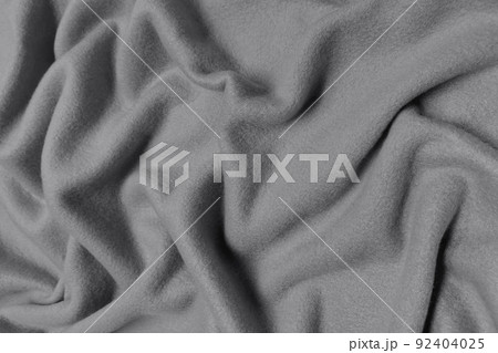 Gray fleece crumpled or wavy fabric texture background. Abstract linen cloth soft waves. Wool fabric. Smooth elegant luxury cloth texture. Concept for banner or advertisement. Gray fleece crumpled or wavy fabric texture background. Abstract linen cloth soft waves. Wool fabric. Smooth elegant luxury cloth texture. Concept for banner or advertisement. 92404025