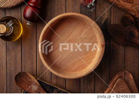 Round wooden empty bowl on the wooden background 92406300