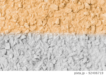 Stone surface painted in two colors white and yellow or orange abstract wall texture background design Stone surface painted in two colors white and yellow or orange abstract wall texture background design 92406719