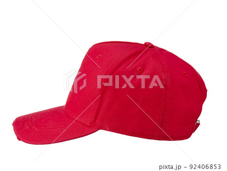 Red textile baseball cap with a visor, isolated on a snow-white background. Side view. Red textile baseball cap with a visor, isolated on a snow-white background. Side view. 92406853