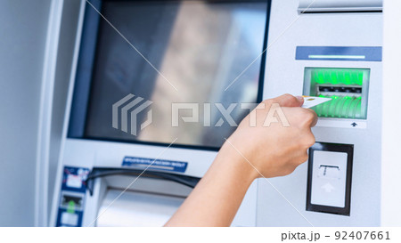 Atm machine screen. Holding american bill cash. Woman withdraw money usd hundred dollar. Money stack, bank credit card. 92407661