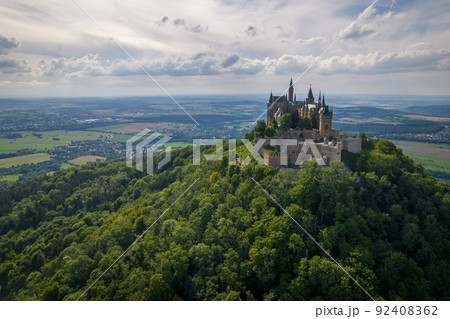 Hohenzollern Castle on forested mountain top in the Swabian Alps in summer 92408362