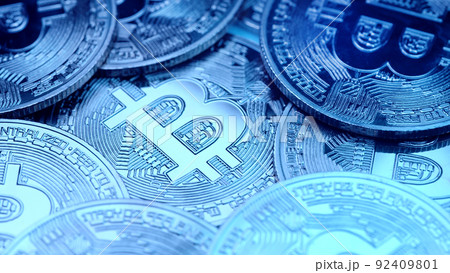 Bitcoin, crypto currency. Blue coins rotating clockwise. Digital exchange, popularity of BTC, symbol 92409801