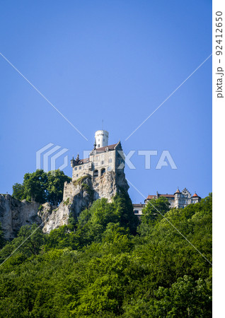 Lichtenstein castle on forested rock cliff in Swabian Alps in summer Lichtenstein castle on forested rock cliff in Swabian Alps in summer 92412650