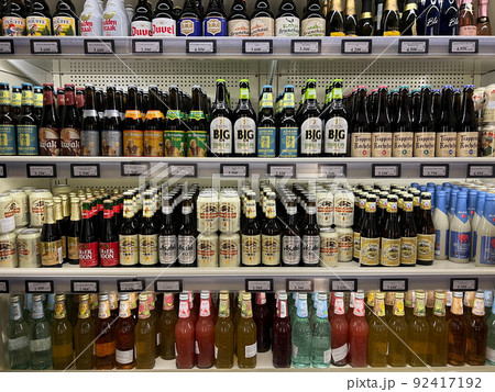 Large selection of low-alcohol drinks and beer on the shelves in the supermarket Large selection of low-alcohol drinks and beer on the shelves in the supermarket 92417192