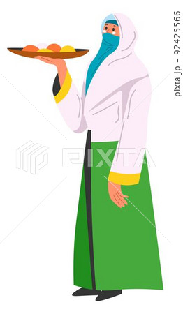 Woman in hijab serving dessert or fruits on tray Woman in hijab serving dessert or fruits on tray 92425566