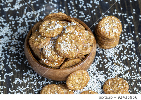 oatmeal thin round cookies with lots of sesame seeds oatmeal thin round cookies with lots of sesame seeds 92435956