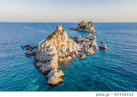 Sveta Nedelja is an islet on the Adriatic Sea, in Montenegrin municipality of Budva. It is located opposite the town of Petrovac na Moru in Montenegro. It has a small church on it Portrait of a Sveta Nedelja is an islet on the Adriatic Sea, in Montenegrin municipality of Budva. It is located opposite the town of Petrovac na Moru in Montenegro. It has a small church on it Portrait of a 92436332