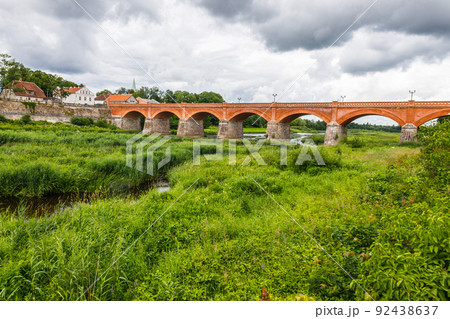 The old brick bridge across the Venta in Kuldiga, Latvia The old brick bridge across the Venta in Kuldiga, Latvia 92438637