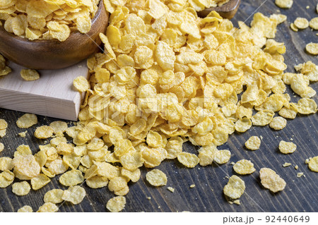 dry breakfast corn flakes of yellow color , close up dry breakfast corn flakes of yellow color , close up 92440649