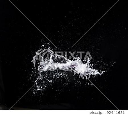 Water splash in air drop over black background, studio lighting high speed 92441621
