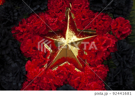 Gold star in colors. Symbol of Red Army. Details of military parade. Gold star in colors. Symbol of Red Army. Details of military parade. 92441681