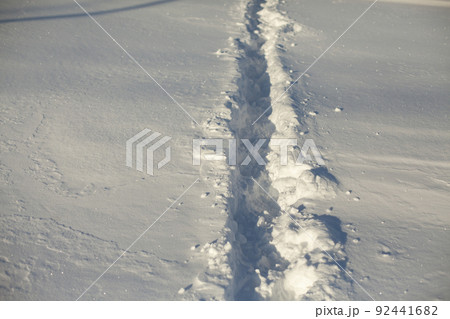Path in snow. Path through deep snow. Path in snow. Path through deep snow. 92441682