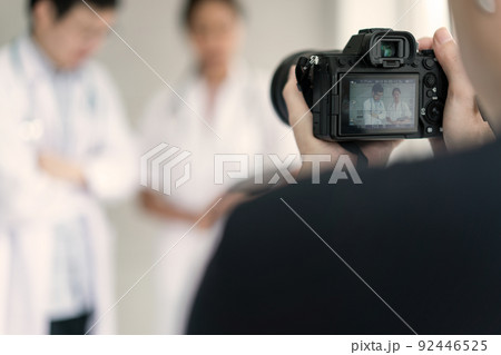 Photographer taking footage on the concept of doctors and nurses for sale on the website Photographer taking footage on the concept of doctors and nurses for sale on the website 92446525