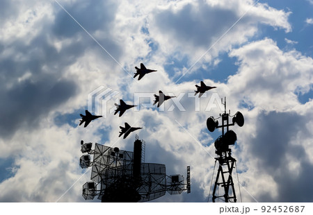 Air defense raiders of military mobile anti-aircraft complexes (radar is designed and automatic tracking of targets and missiles) against the background of the flight of modern combat fighters,Russia Air defense raiders of military mobile anti-aircraft complexes (radar is designed and automatic tracking of targets and missiles) against the background of the flight of modern combat fighters,Russia 92452687