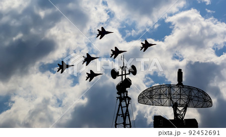 Air defense raiders of military mobile anti-aircraft complexes (radar is designed  and automatic tracking of targets and missiles) against the background of the flight of modern combat fighters,Russia 92452691