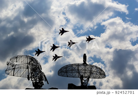 Air defense raiders of military mobile anti-aircraft complexes (radar is designed and automatic tracking of targets and missiles) against the background of the flight of modern combat fighters,Russia Air defense raiders of military mobile anti-aircraft complexes (radar is designed and automatic tracking of targets and missiles) against the background of the flight of modern combat fighters,Russia 92452701