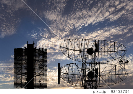 Air defense radars of military mobile anti aircraft systems (radar is designed  and automatic tracking of targets and missiles) , modern army industry on background clouds and sky,Russia 92452734