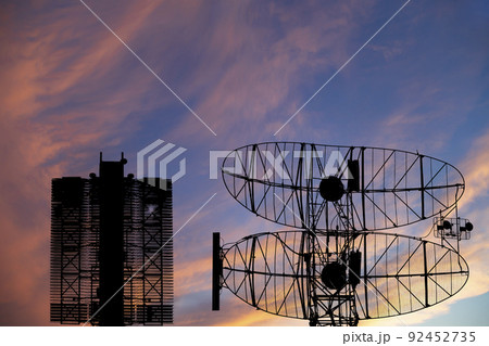Air defense radars of military mobile anti aircraft systems (radar is designed and automatic tracking of targets and missiles) , on the background of the sunset orange sky, Russia Air defense radars of military mobile anti aircraft systems (radar is designed and automatic tracking of targets and missiles) , on the background of the sunset orange sky, Russia 92452735