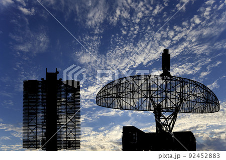 Air defense radars of military mobile anti aircraft systems (radar is designed  and automatic tracking of targets and missiles) , modern army industry on background clouds and sky,Russia 92452883