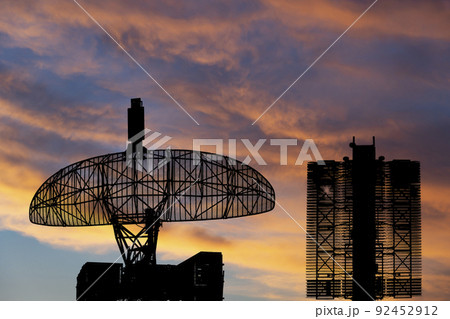 Air defense radars of military mobile anti aircraft systems (radar is designed and automatic tracking of targets and missiles) , on the background of the sunset orange sky, Russia Air defense radars of military mobile anti aircraft systems (radar is designed and automatic tracking of targets and missiles) , on the background of the sunset orange sky, Russia 92452912