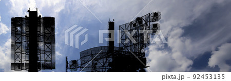 Air defense radars of military mobile anti aircraft systems (radar is designed  and automatic tracking of targets and missiles) , modern army industry on background clouds and sky,Russia 92453135