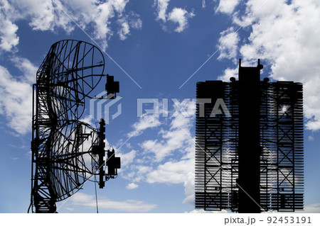 Air defense radars of military mobile anti aircraft systems (radar is designed  and automatic tracking of targets and missiles) , modern army industry on background clouds and sky,Russia 92453191