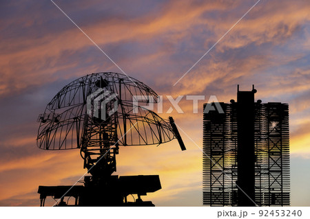 Air defense radars of military mobile anti aircraft systems (radar is designed and automatic tracking of targets and missiles) , on the background of the sunset orange sky, Russia Air defense radars of military mobile anti aircraft systems (radar is designed and automatic tracking of targets and missiles) , on the background of the sunset orange sky, Russia 92453240