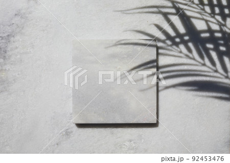Marble stone display flat lay podium on travertine stone background and palm shadow. Product promotion Beauty cosmetic showcase. 92453476