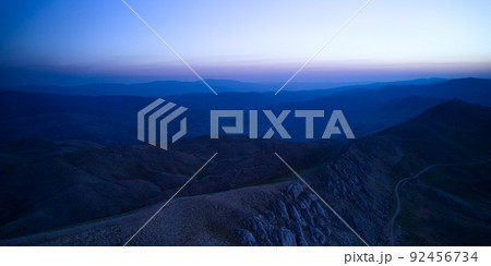 Scenic view of sunrise in a mountainside 92456734