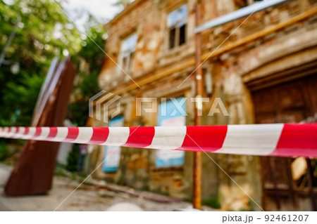 fence tape at the old ruined building. house out-of-focus 92461207